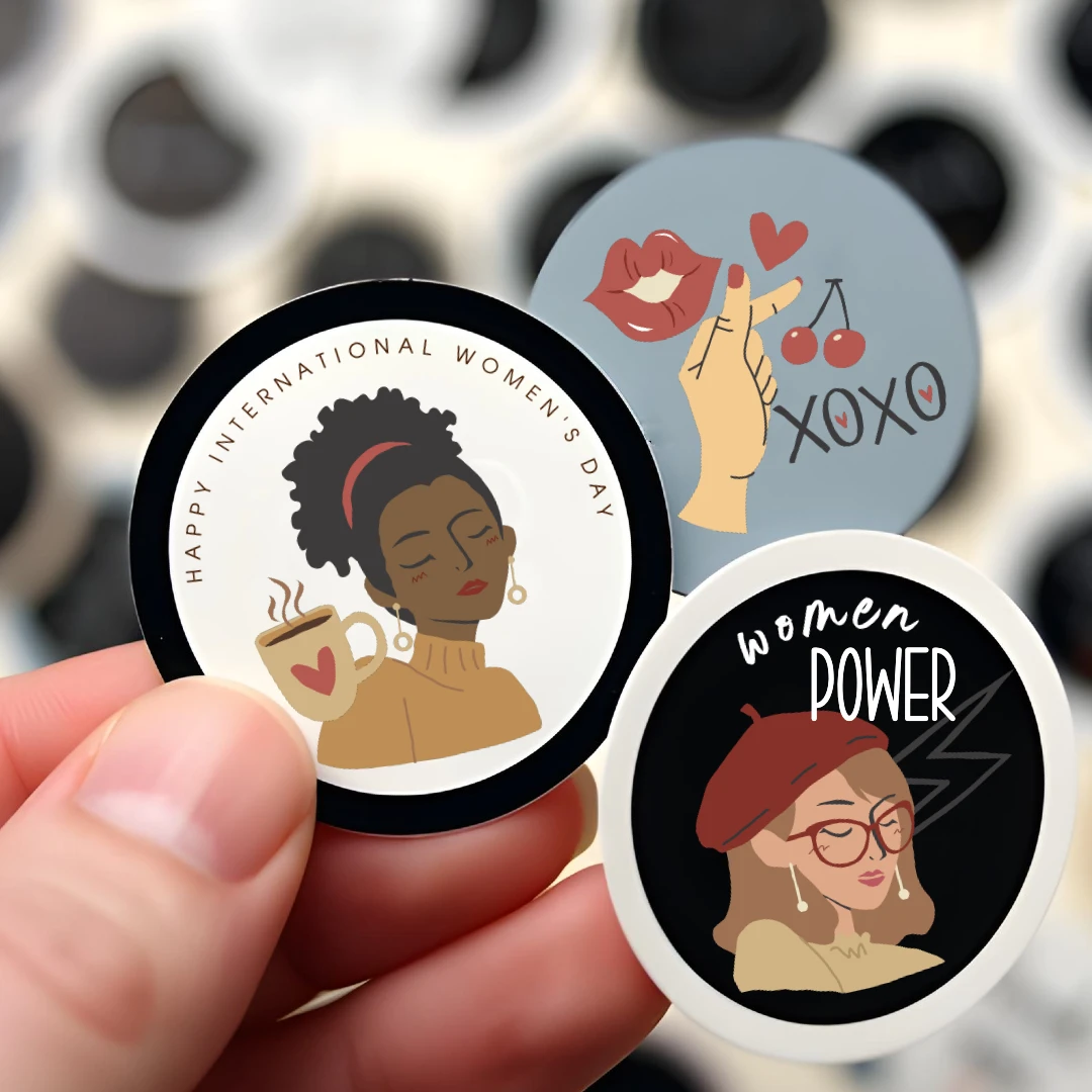 Three colorful stickers celebrating Women's Day, featuring coffee, kisses, and the phrase 