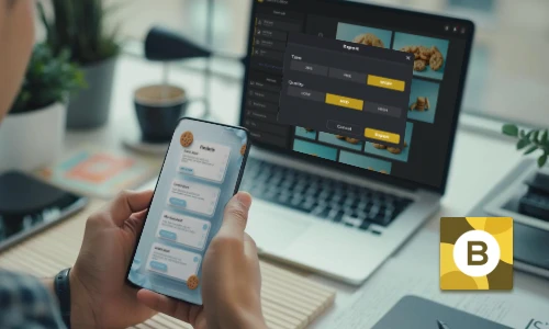 Person holding a smartphone with a food ordering app open, laptop in background displaying website design.